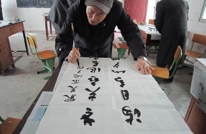 岩峰二校承办片区退休教师书法比赛活动
